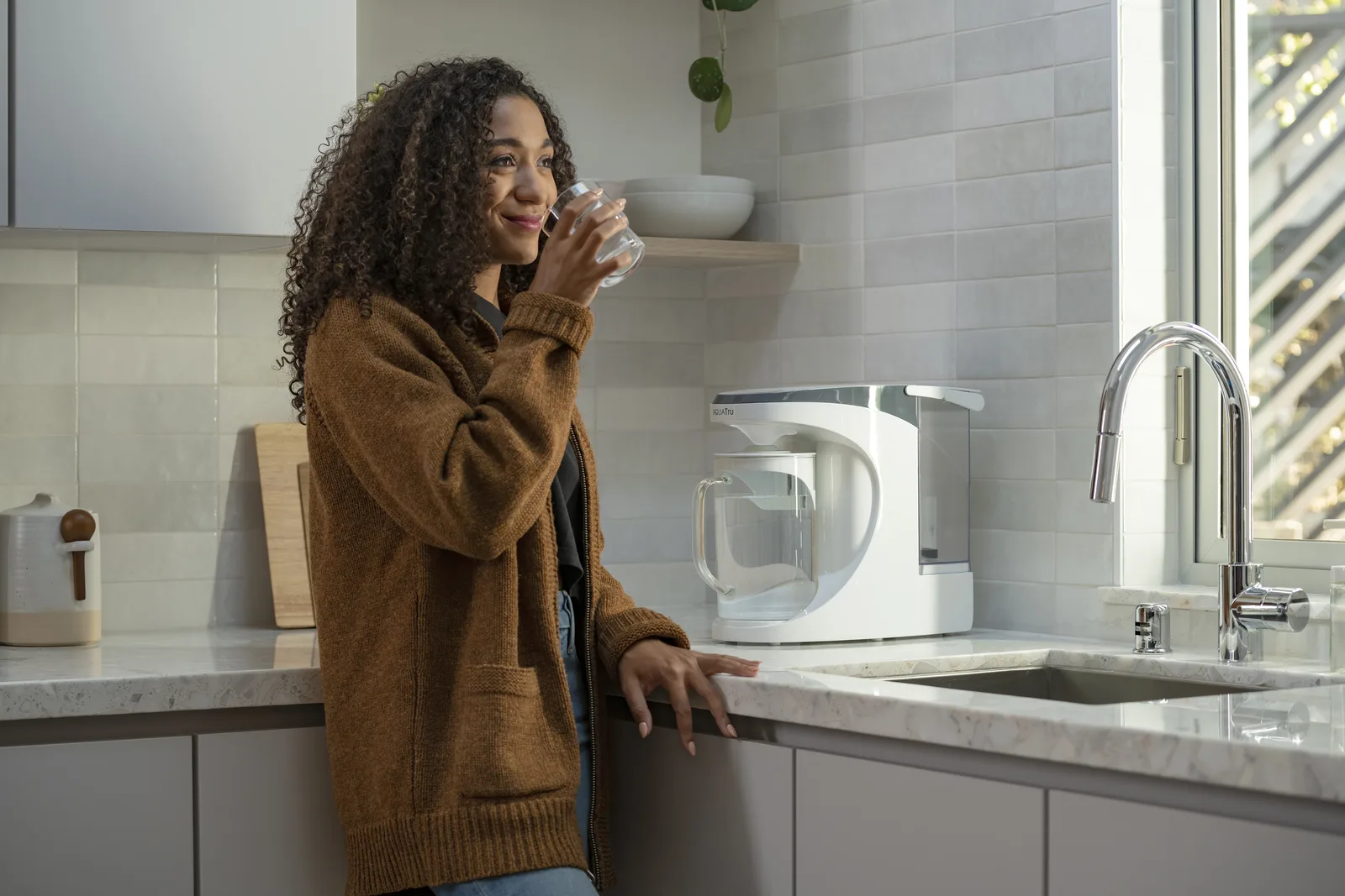 AquaTru countertop water purifier in a kitchen setting